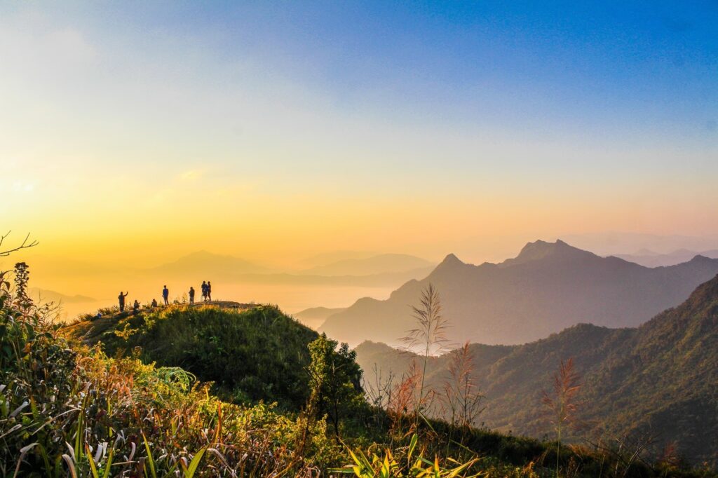 photo of people standing on top of mountain near grasses 733162 slider 5